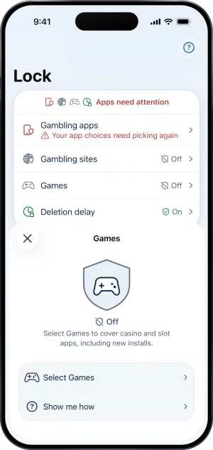 The Games sheet while Games is not selected: a shield with a controller reading Off, Select Games to cover casino and slot apps, including new installs., and the rows Select Games and Show me how. Behind it Lock reads Apps need attention.